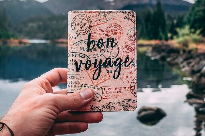 passport cover with phrase "Bon voyage"