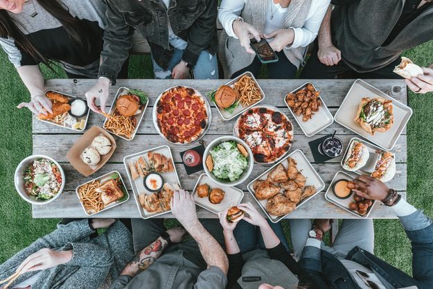 table with food and people