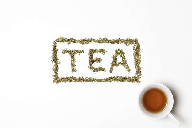 white cup and tea leaves