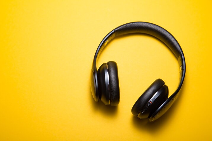 black headphones on the yellow background