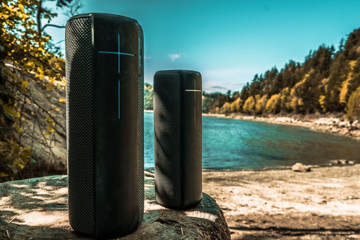 two portable speakers on the nature